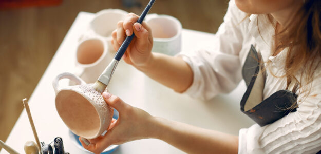 cropped a young woman mpainting dishes in a pottery 2024 12 06 12 46 47 utc scaled 1